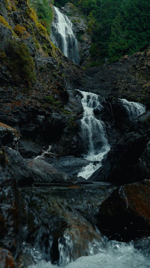 Beautiful Waterfalls In Mountain Forest