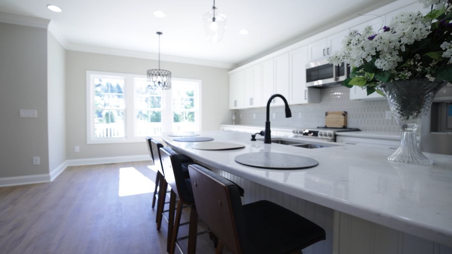 Spotless white kitchen with island