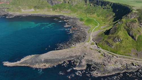 Aerial video of Giants Causeway Atlantic Ocean on North Coast Co Antrim Northern Ireland