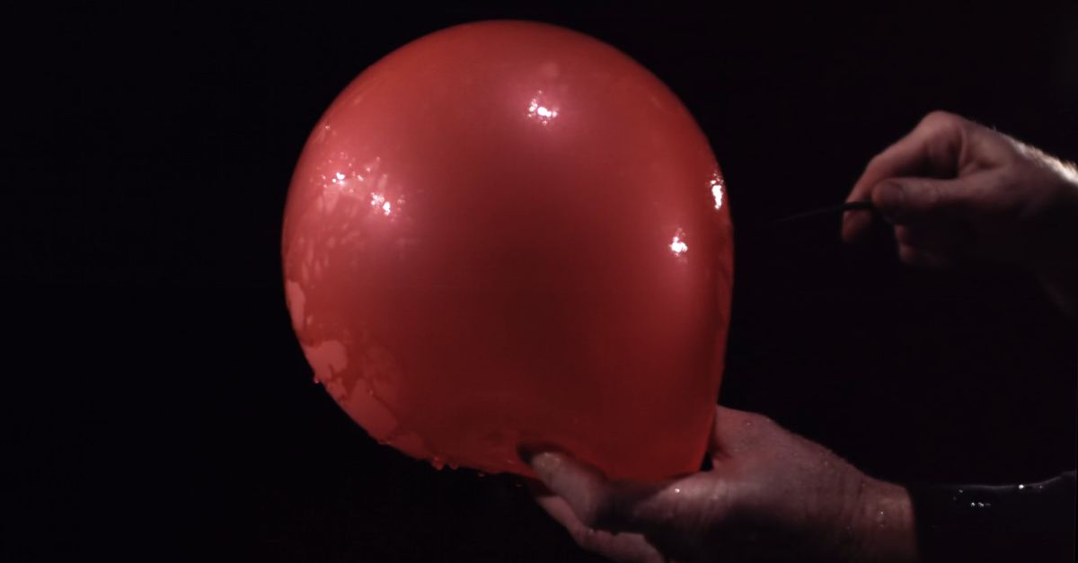 Someone Using An Object A person is holding a red object in their hands Free Stock Video ...