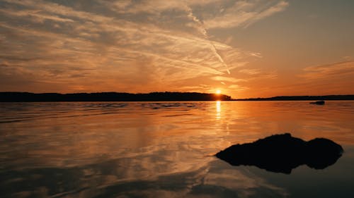 Sunset Reflection On Calm Peaceful Lake At Golden Hour