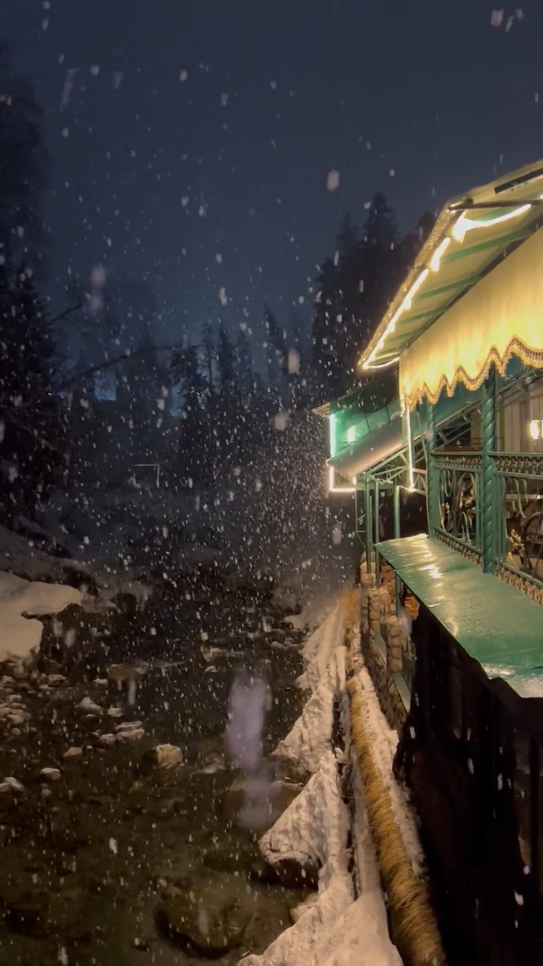 A house with a green roof and a snow covered river Free Stock Video ...