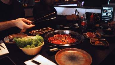 a person is cooking food on a table