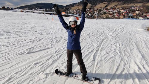 a female snowboarder warming up