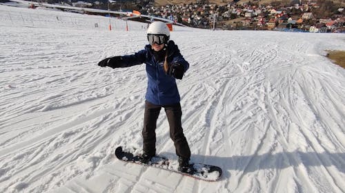 a female snowboarder warming up