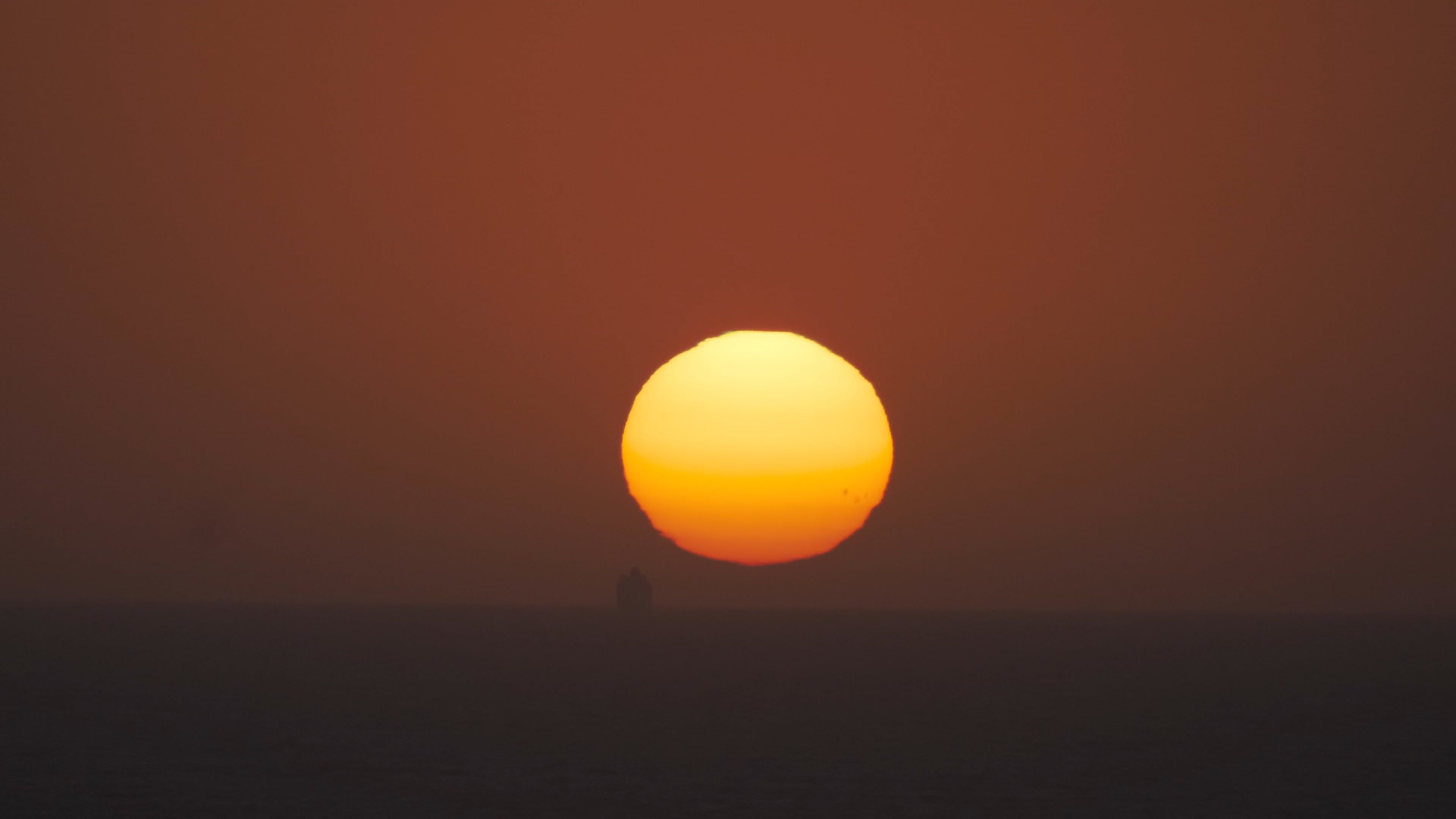 The sun setting over the horizon in the desert Free Stock Video Footage ...