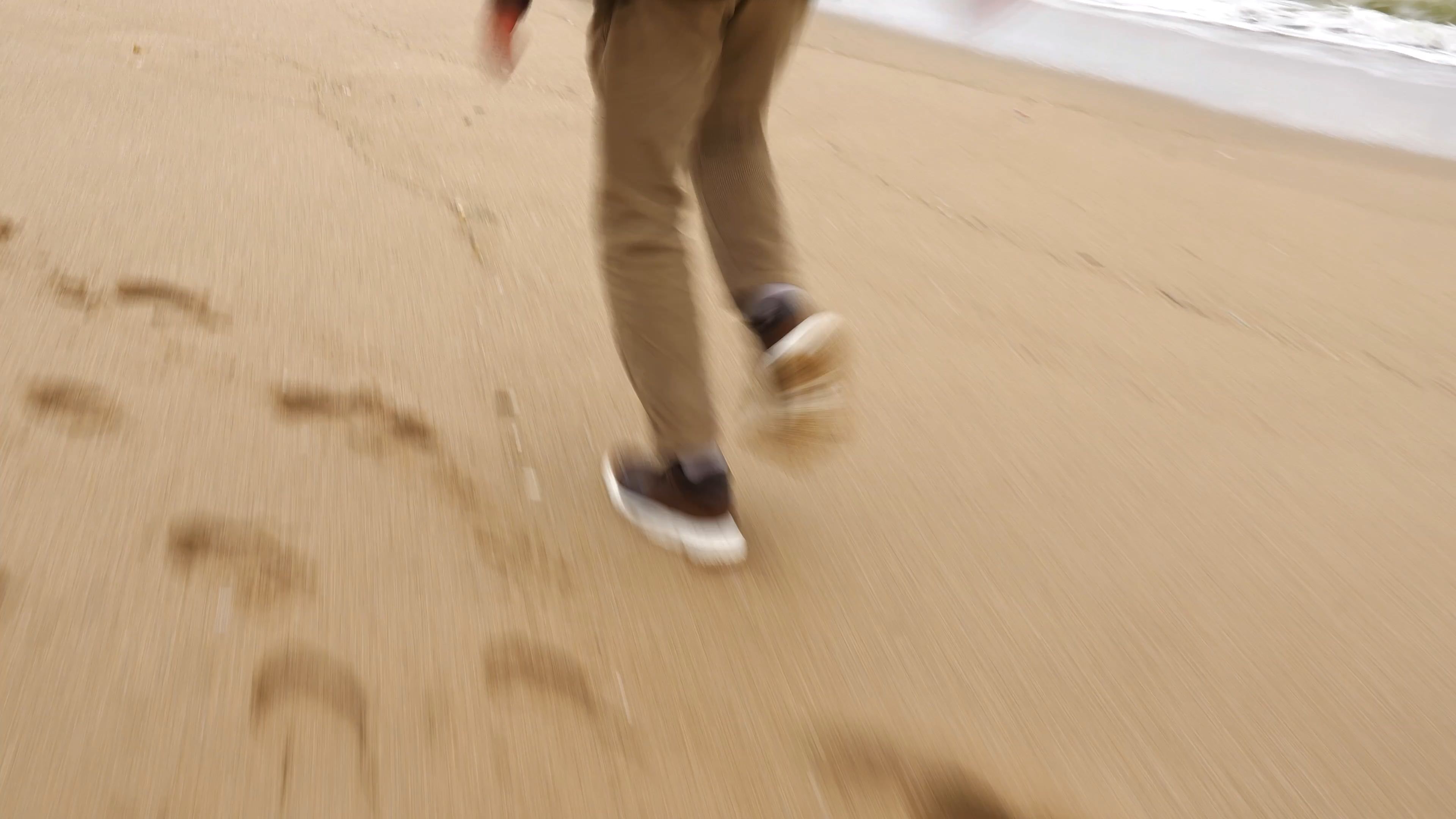 a person walking on the beach with their feet in the air 19970603 — free pexels stock footage