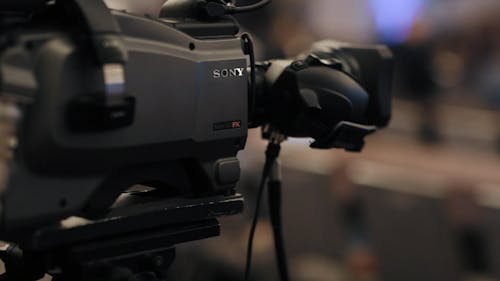 Close-Up View Of A Camera On Blur Background