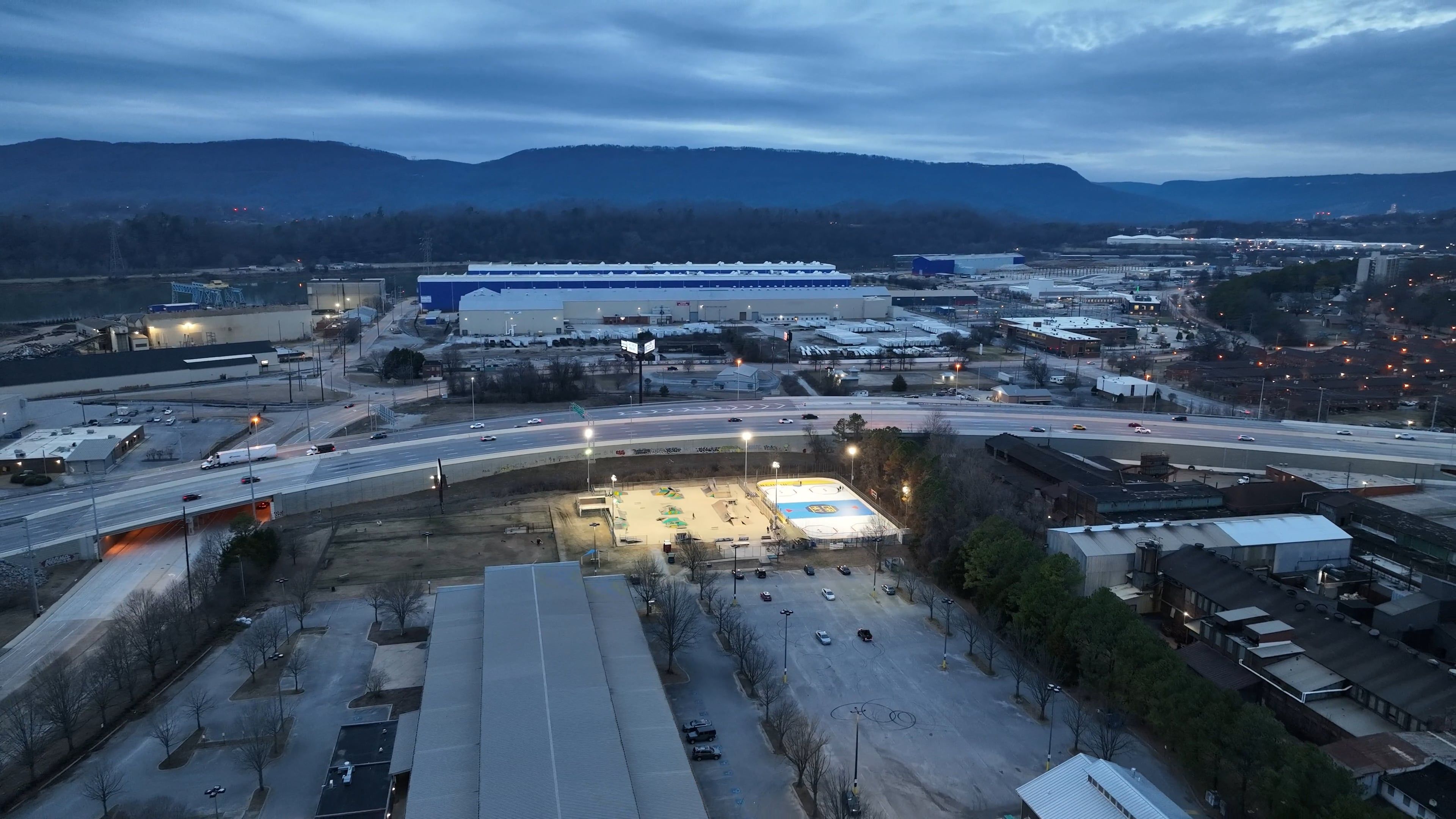 Roller Hockey Rink and Skate Park by the Highway with city backdrop ...