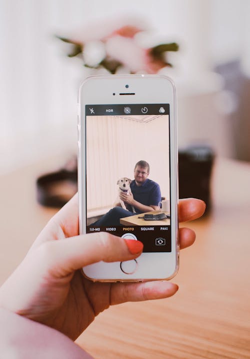 Hand Of A Woman Holding An Iphone 