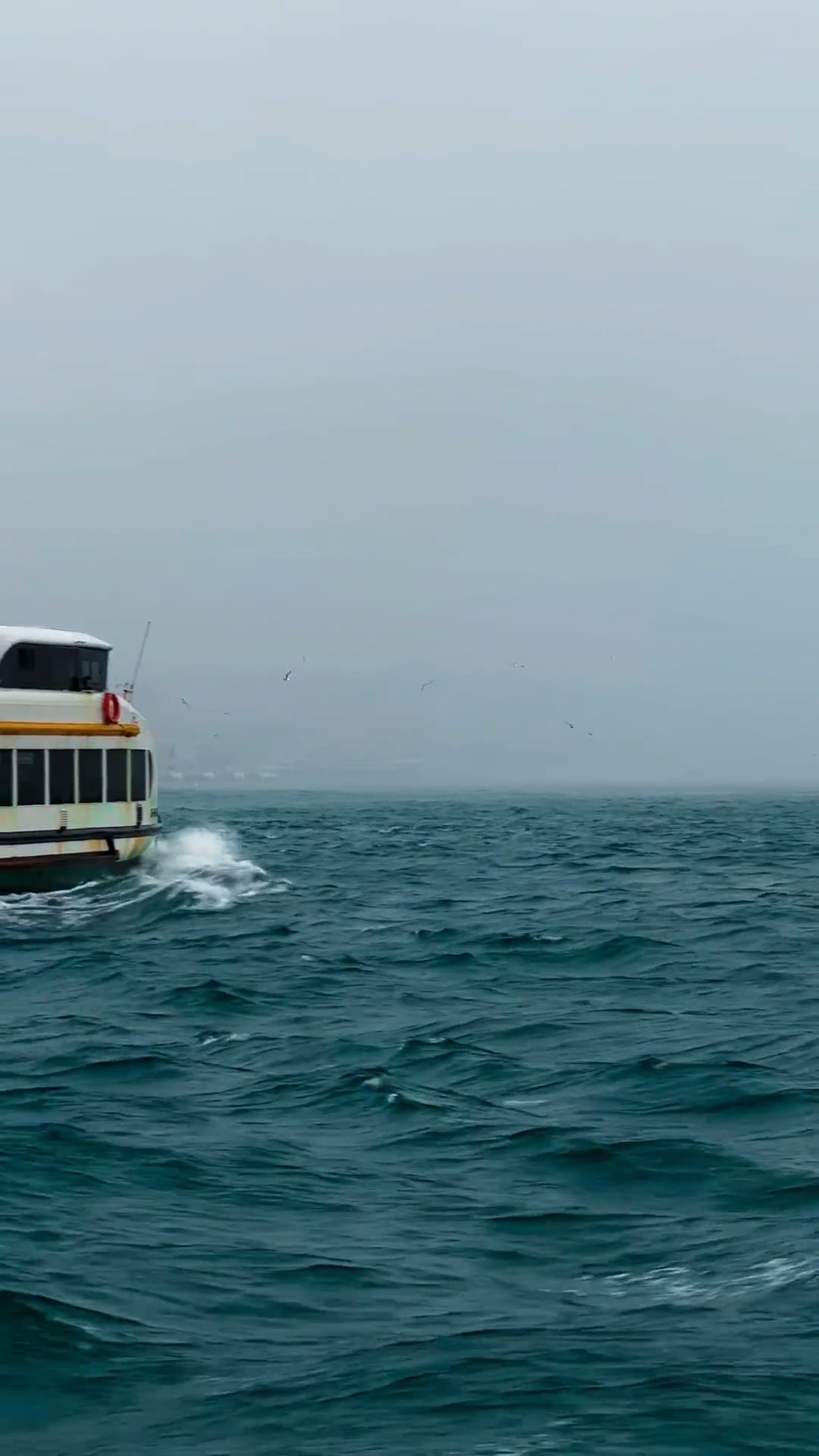 A boat traveling through the ocean on a cloudy day Free Stock Video ...