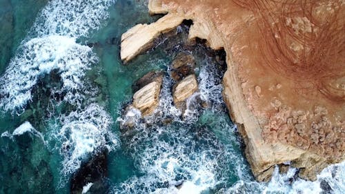 blue sea waves crashing on rocks cyprus