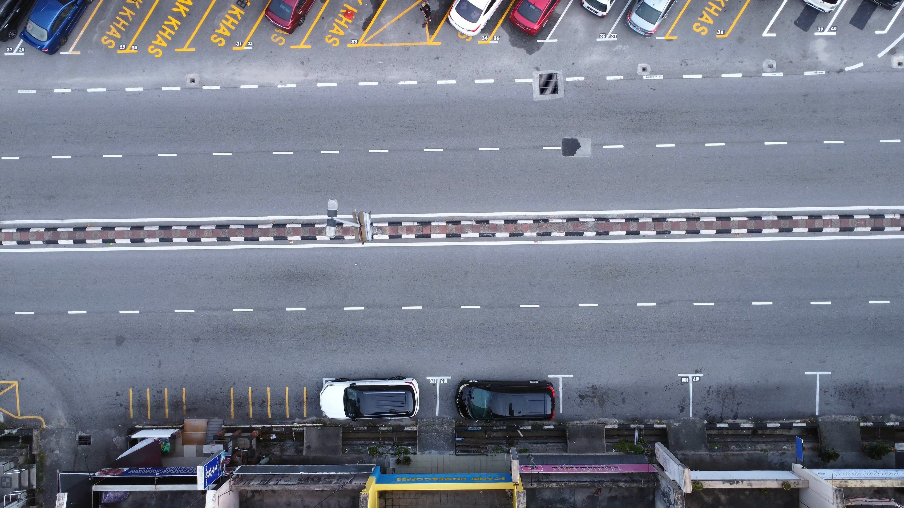 An aerial view of a parking lot with cars Free Stock Video Footage ...