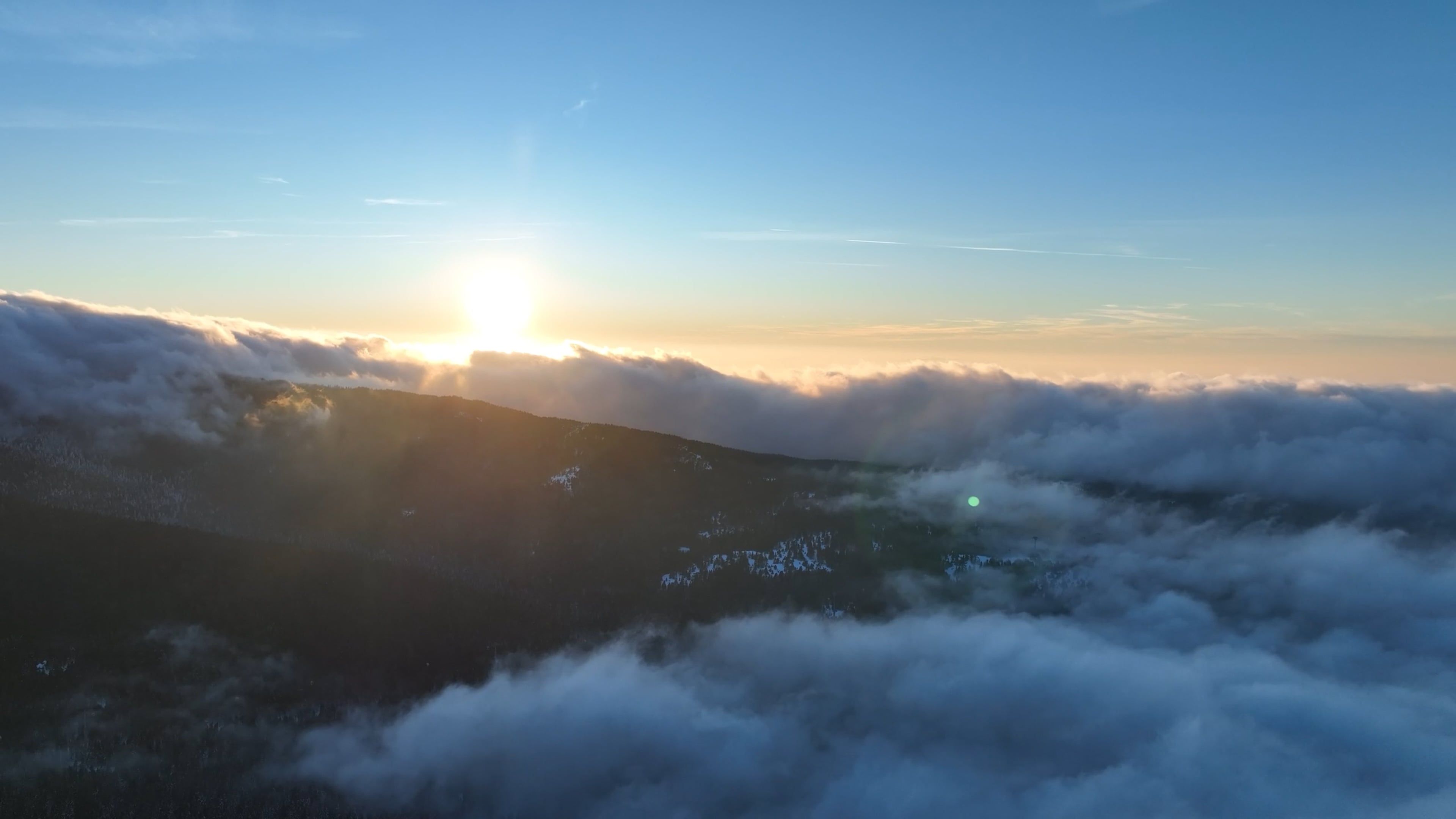 The sun rising over the clouds above a valley Free Stock Video Footage ...