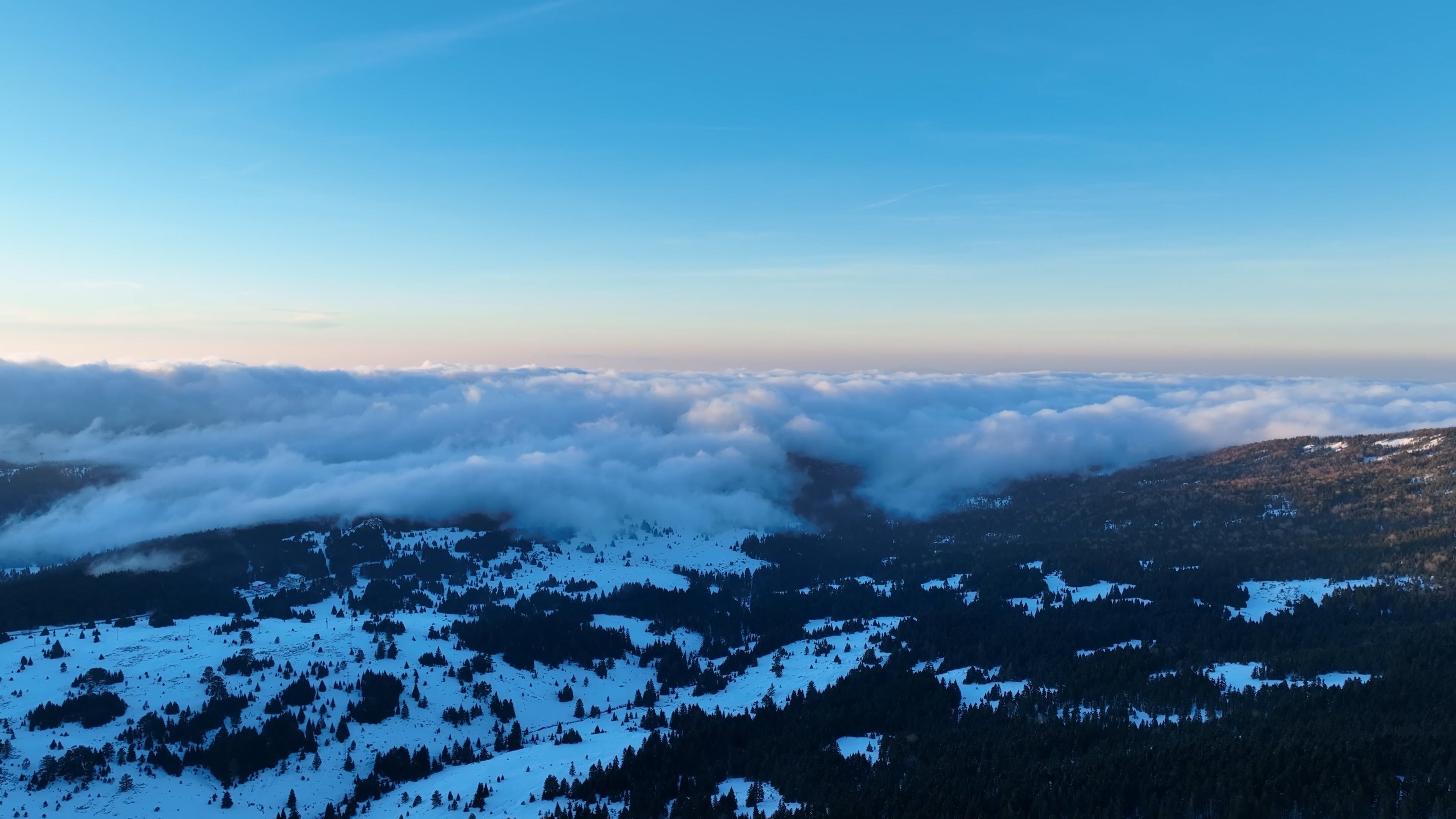 Drone Footage of Low Clouds in a Mountain Landscape at Sunset Free ...