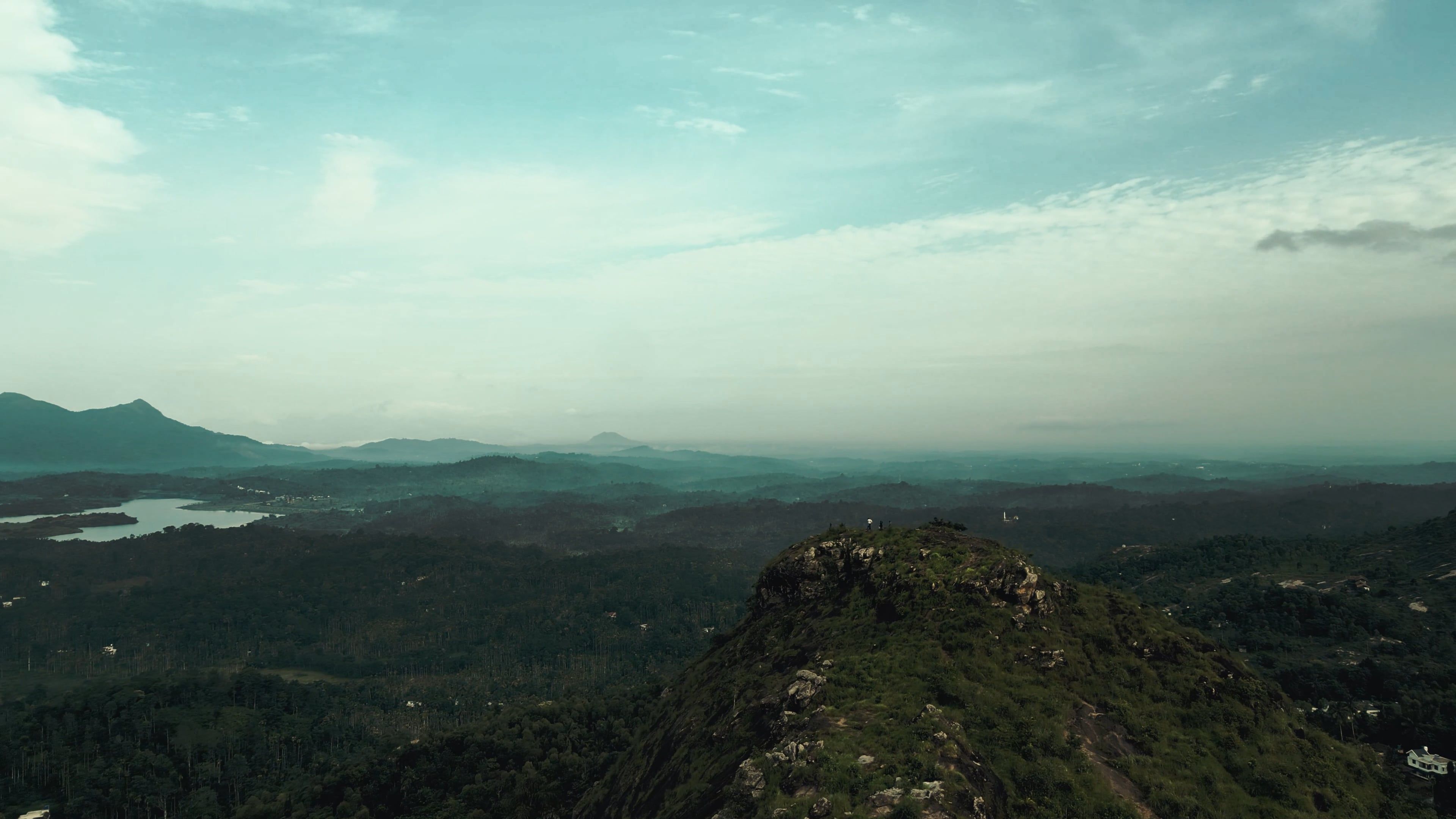 A view of a mountain with a lake and mountains Free Stock Video Footage ...