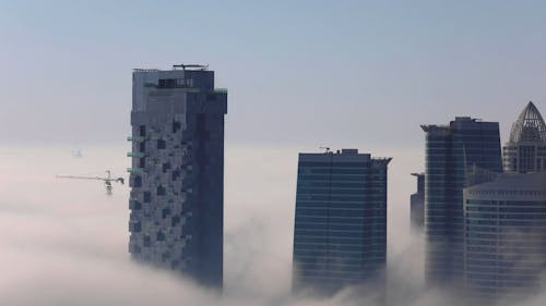 Buildings With A Foggy Background In Timelapse Mode
