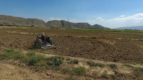 A farmer on a tractor in Balochistan