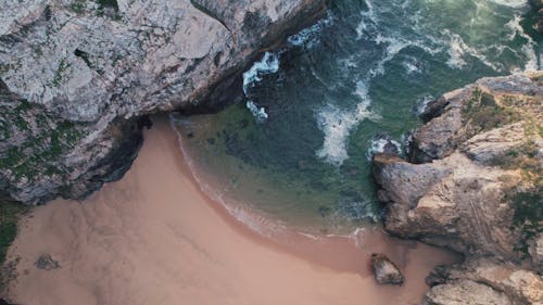 Drone view of Hidden Beach between rocks, Cabo da Roca, Portugal