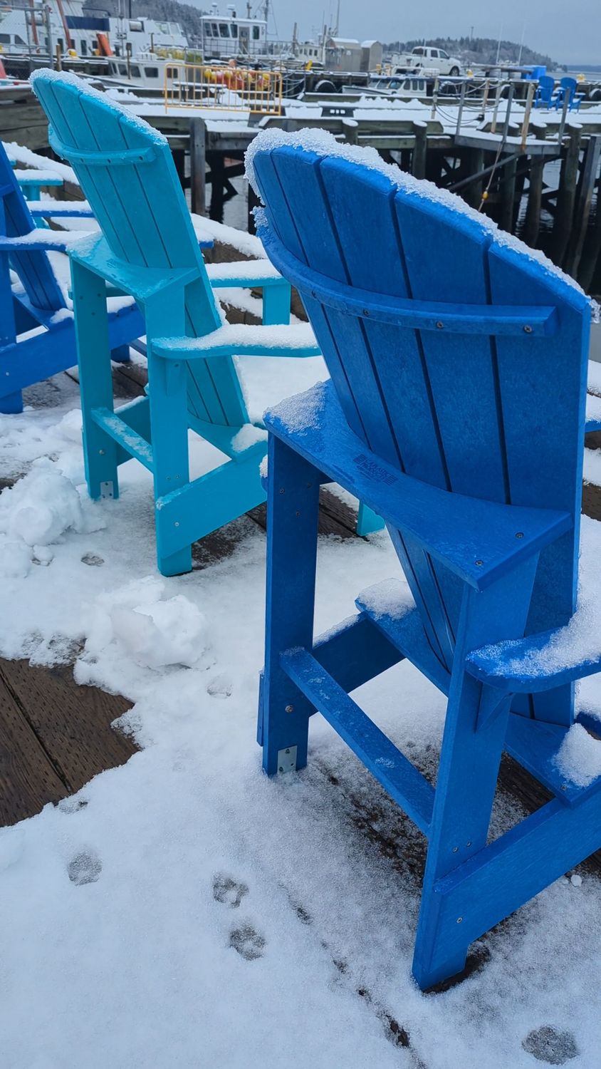 A blue chair sits on a snowy dock Free Stock Video Footage, Royalty ...