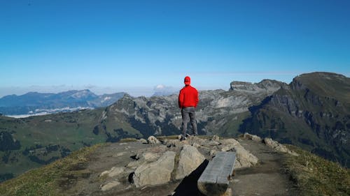 Person Overlooking The View Of Mountains