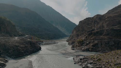 Aerial shot of a bridge over a river in Northern Pakistan