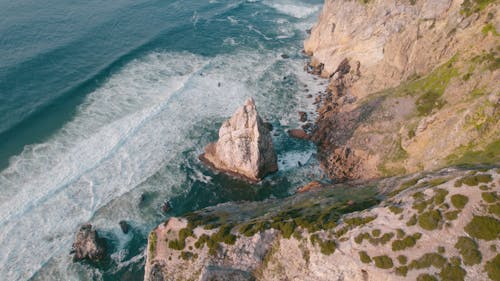 Drone Orbit shot of a Coastal Landmark by the Cliffs and Atlantic Ocean in Portugal