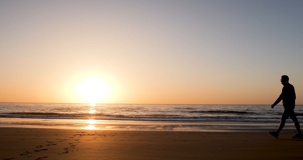 A man walking on the beach at sunset Free Stock Video Footage, Royalty ...