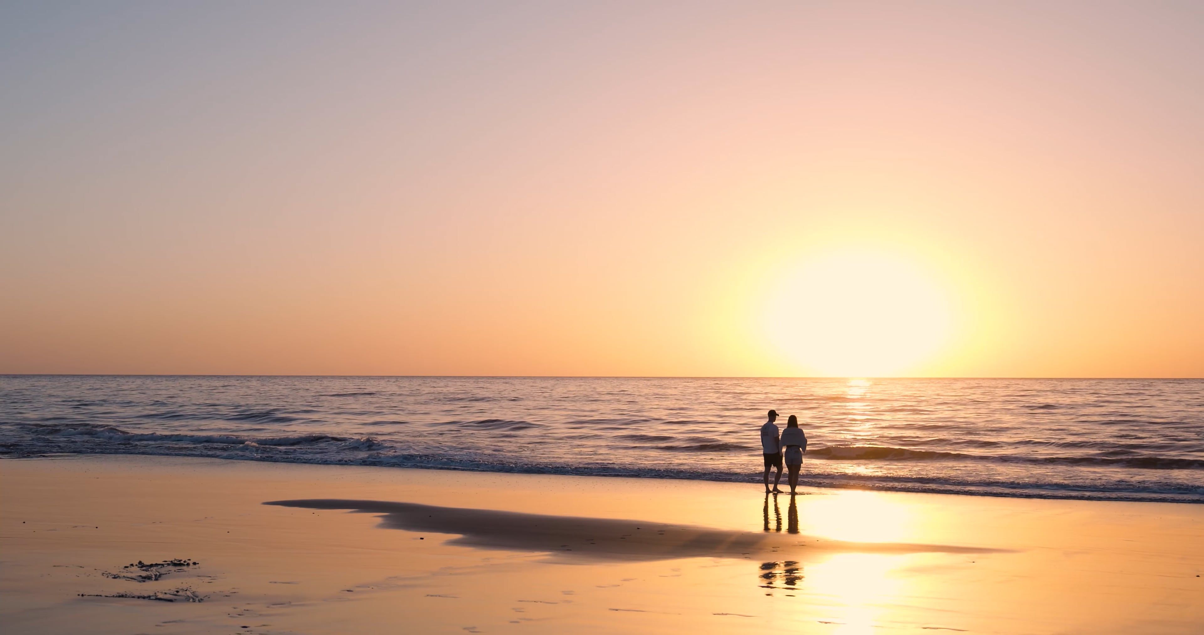 Two people walking on the beach at sunset Free Stock Video Footage ...