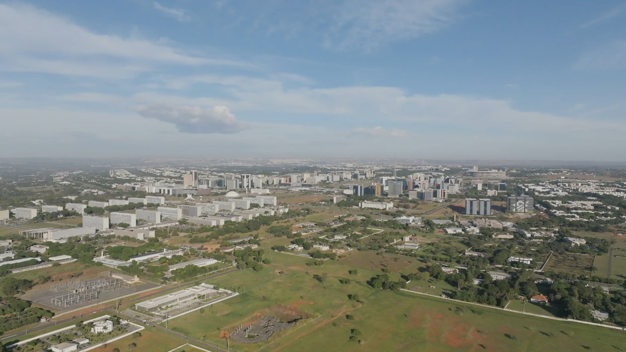 An aerial view of a city with a large green field Free Stock Video ...