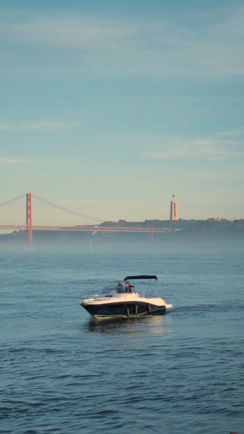 Cinematic view of theTejo River and Ponte 25 de Abril in Lisbon