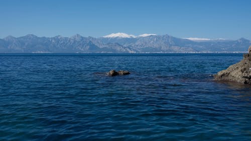 beautiful seascape and snowy mountains