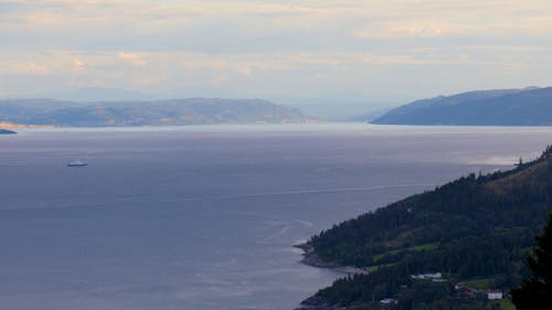 Boats sailing on the sea in the evening at sunset - Norway