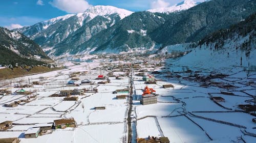 A Beautiful Mountain snow Valley Aerial Viewsnow,winter,nature,mountains,landscape,mountain,cold,white,sunset,snowfall,snowing,rock,landscape,travel,lake,sky,cloud,tree,house,home,architec...