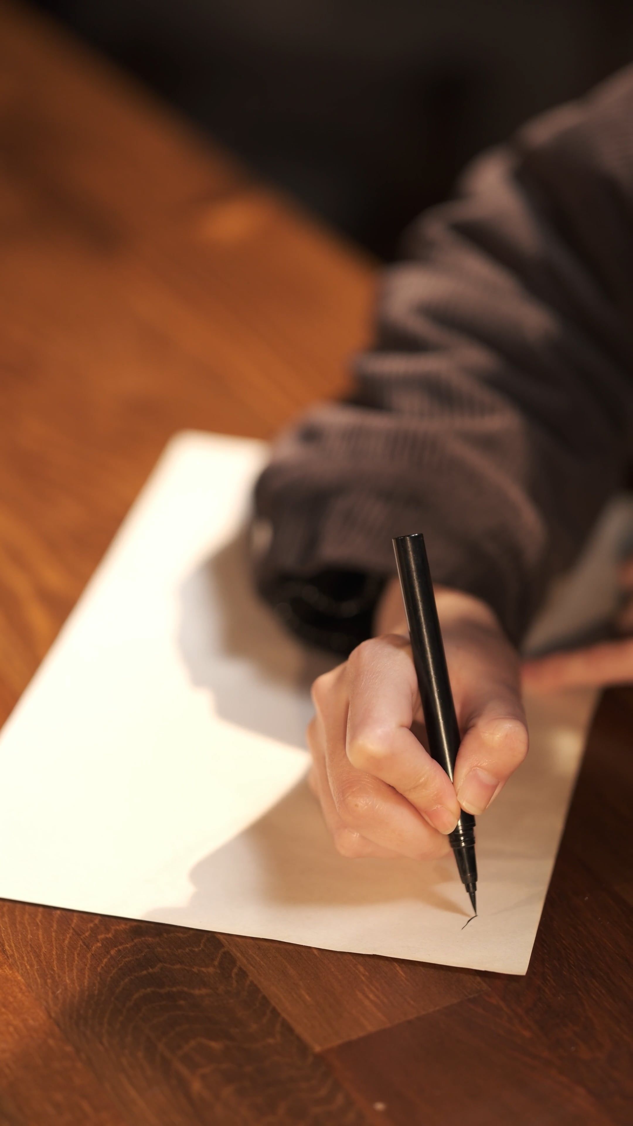 A person writing on a piece of paper with a pen Free Stock Video ...