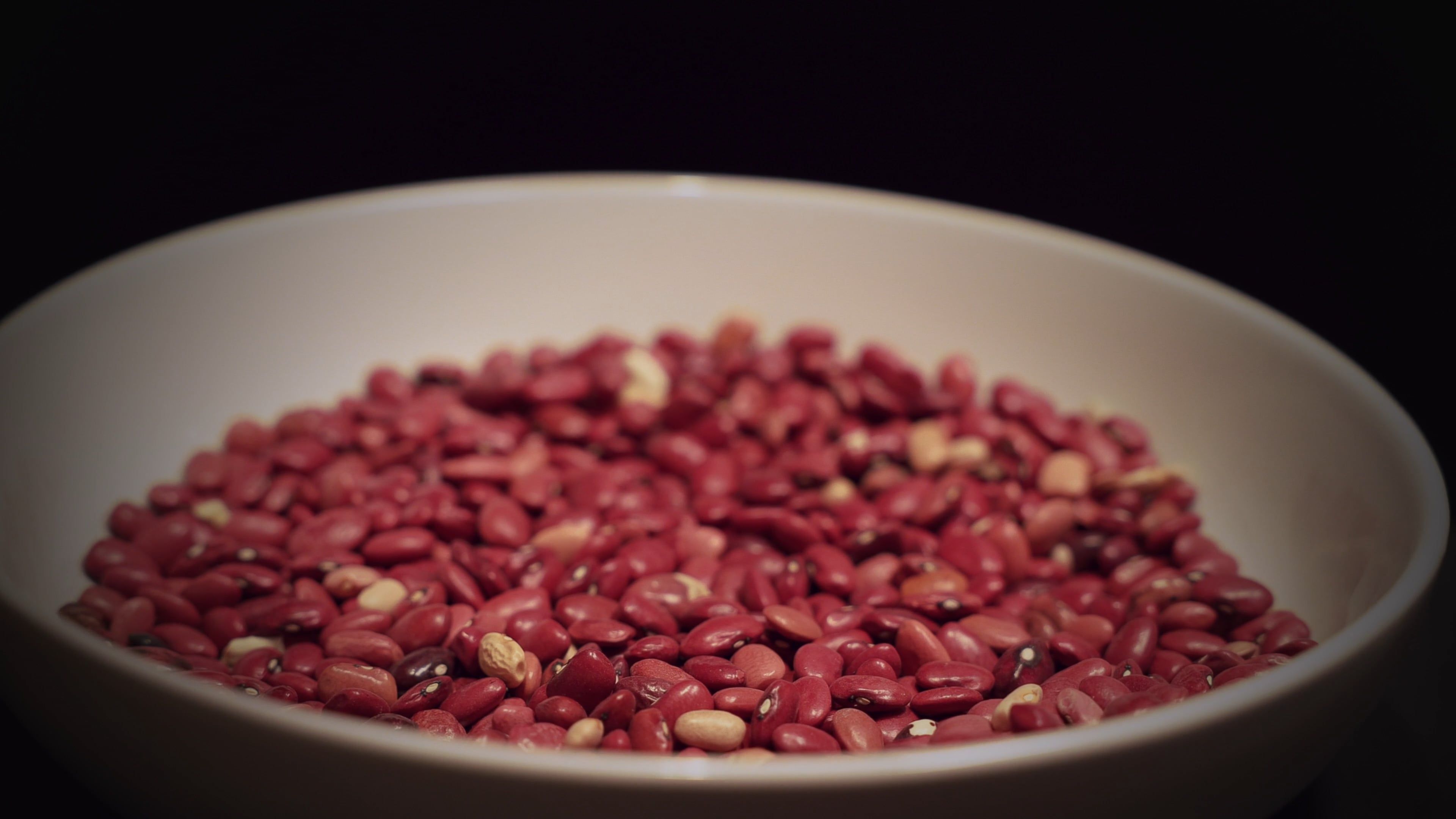 A bowl of red beans being poured into a bowl Free Stock Video Footage ...