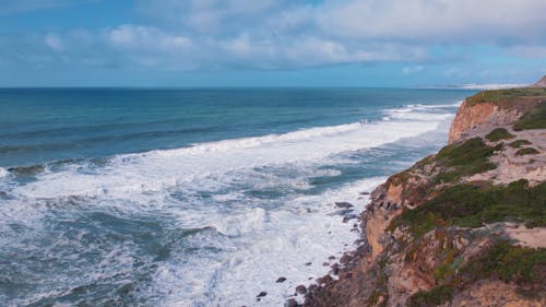 Aerial Shots of Magoito Beach's Green Cliffs in Sintra, Portugal