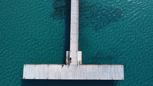 aerial view of  jetty and blue sea