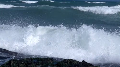 Waves Crashing The Sea Rocks