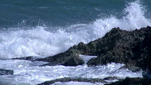 Waves Crashing To The Rocks