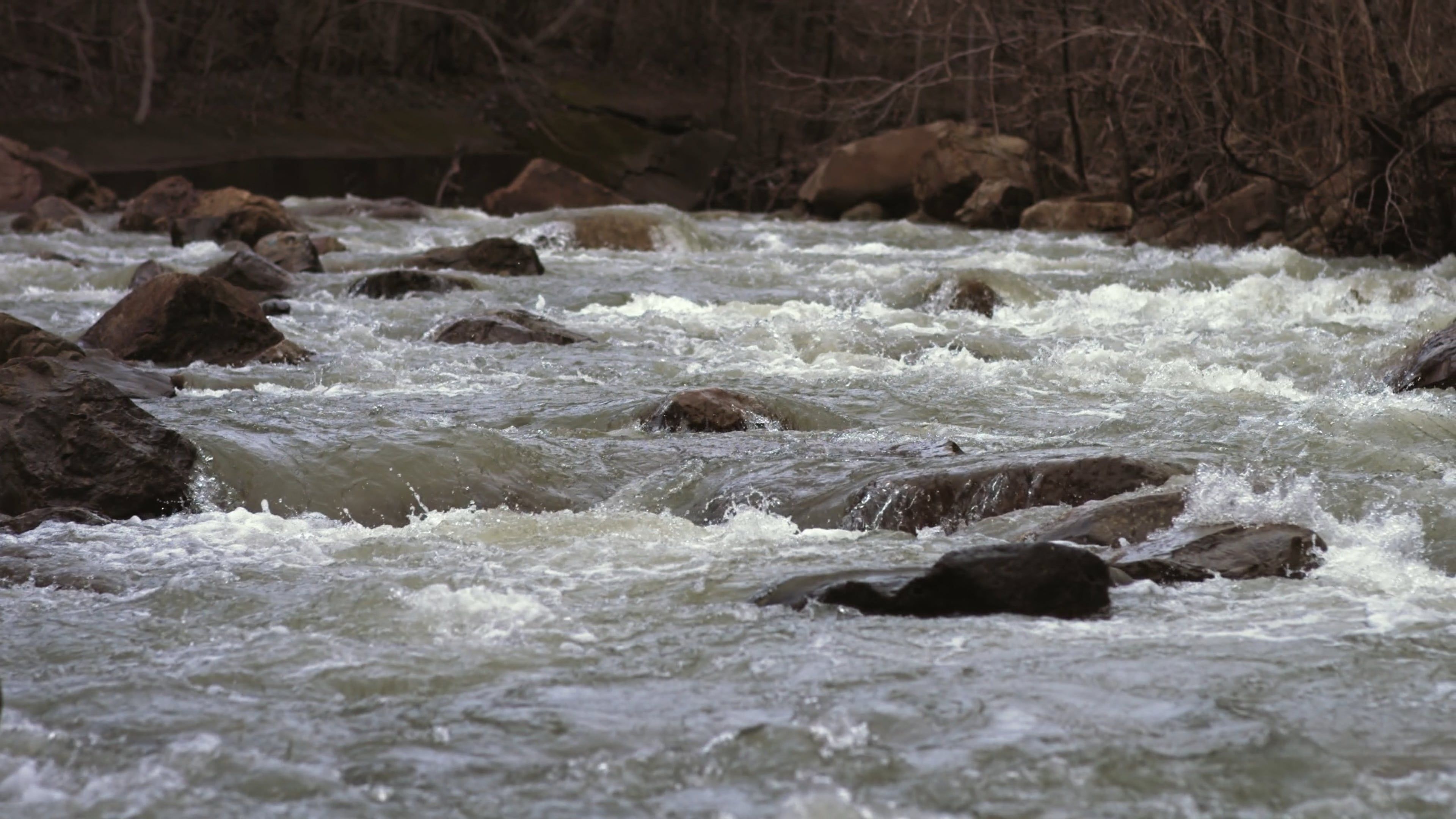 a river with rocks and trees in the background 20597835 — free pexels stock footage