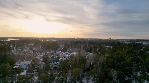 Red sky and snwoy forest and frozen lake 