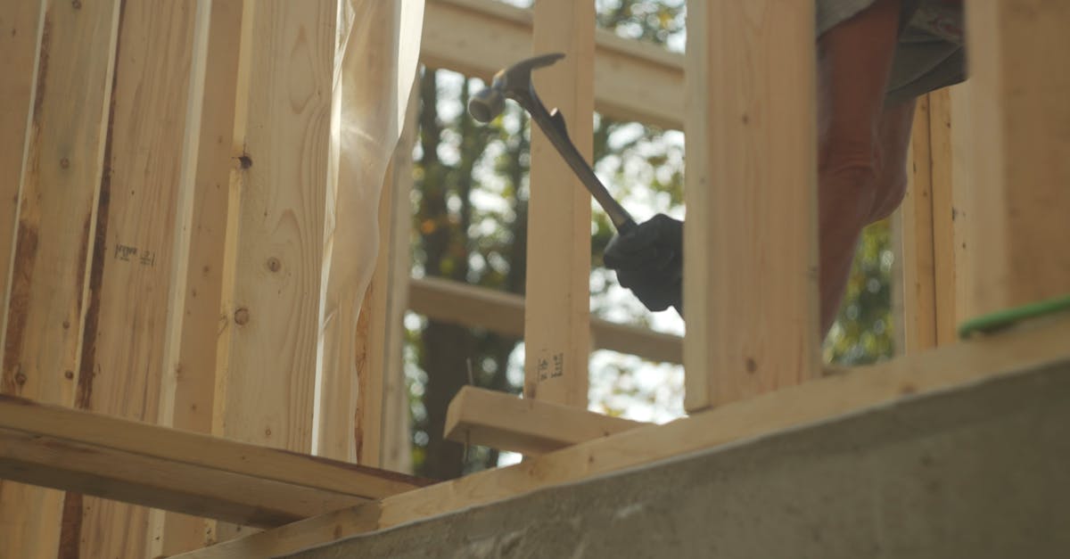 House Framer Pulling Nails Out of Board with Hammer Free Stock Video