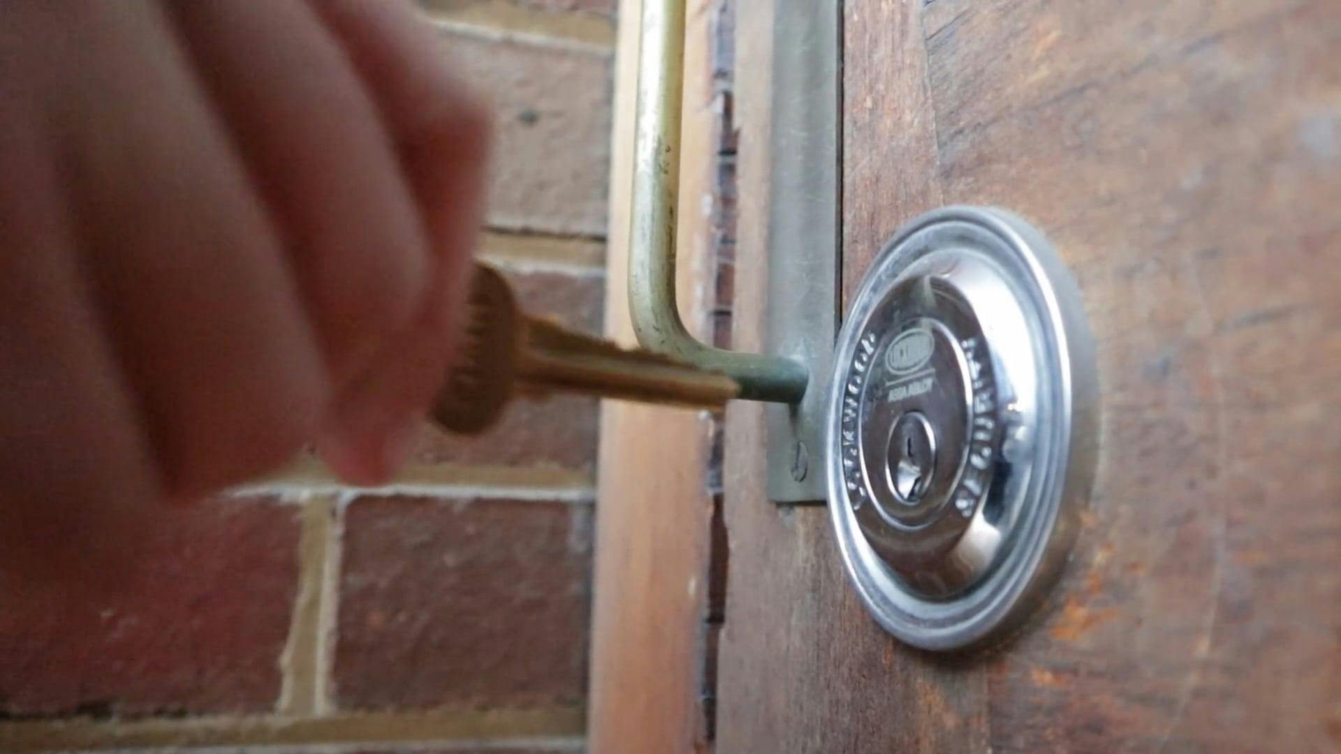 person-locking-the-door-with-a-key-free-stock-video