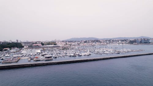 Cloudy Skies Over Cascais Marina - Drone View of Yachts in Lisbon, Portugal