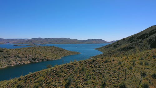 Blue Sky Above A Blue Body Of Water