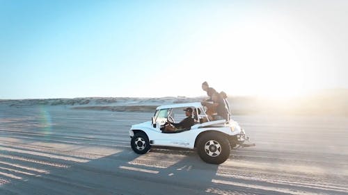 Two Vehicles Traveling In The Desert