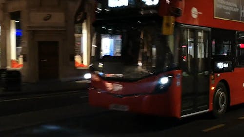 Red Bus Traveling In The City