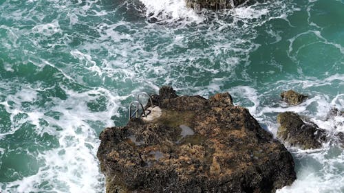 Waves Crashing To The Rocks