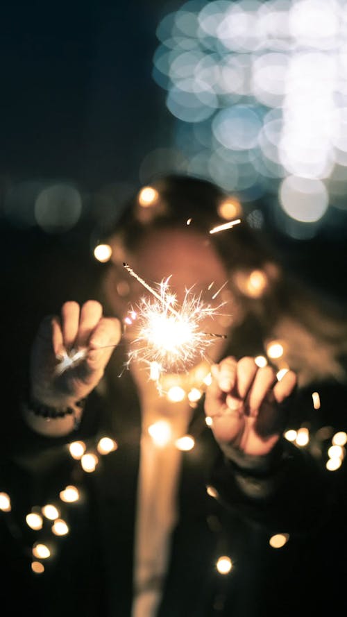 Person Holding Sparklers